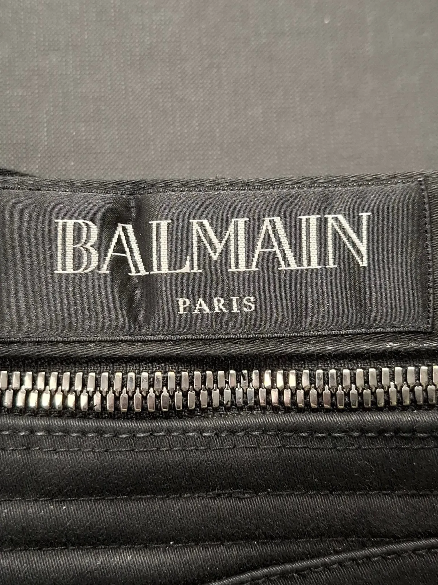 Balmain Waxed Slim-Fit Biker Jeans in Black Cotton Denim